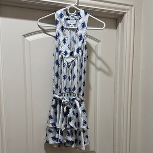 Light blue mini dress with royal blue eyes as the fun design and ruffle skirt.